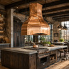 Large rustic industrial kitchen with smooth hand-polished copper island range hood above a central cooking island