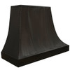 Black zinc kitchen range hood with trapezoidal canopy angled view with flared base, riveted seams, and brushed industrial finish