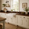 Rustic farmhouse kitchen with a handcrafted hammered copper kitchen countertop and a backsplash
