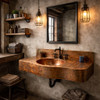 Copper bathroom sink with integrated hammered countertop in a rustic industrial bathroom furnished with matte black plumbing, raw steel shelving, exposed hardware, rough-sawn wood, and metal-framed mirror