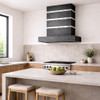 Zinc range hood with contrasting metal straps and rivets in minimalist kitchen with flat cabinets and clean lines