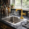 Industrial pipe style brass faucets with wheel handle at bar prep sink, exposed brass fittings and focused downlight over basin