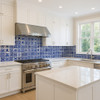 Modern kitchen backsplash with blue and white Mexican tile mix