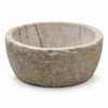 Round cantera stone vessel sink with thick rim and natural stone texture on white background