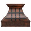 Rustic hammered copper range hood with darkened copper straps and grapevine apron front view, warm patina canopy with riveted bands and decorative vineyard motif