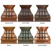 Hammered copper range hood with darkened copper straps shown in different patina finishes