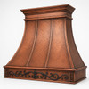 Victorian scroll copper range hood angled view with hammered copper body and forged iron apron detail on white background
