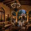 Sculptural iron chandelier with layered loop scrollwork in a covered luxury hacienda courtyard