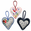 Artisan Cottage Heart Decorations with floral fabrics, hand stitching, buttons, and hanging loops back view on white background