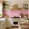 Mexican talavera tiles in light pink for elegant interior spaces featured as a cottage kitchen backsplash with wood cabinetry