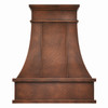 Hammered chandelier copper range hood with tall apron isolated on white background showing handcrafted hammered texture