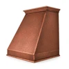 Sloping copper range hood with stepped crown side view on white background with stepped crown molding