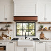 Contemporary farmhouse kitchen with hammered copper range hood, black window and shaker cabinets