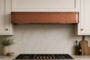 Hammered copper under-cabinet box hood with riveted top and bottom bands