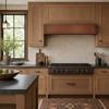Contemporary Arts and Crafts kitchen with hammered copper box hood, white oak cabinetry and handmade tile