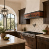 Modern Spanish Colonial kitchen with hammered copper under-cabinet range hood, zinc bands and forged iron scrollwork