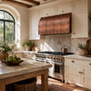 Under-cabinet hammered copper hood in a modern farmhouse kitchen with white cabinets, oak and marble surfaces