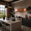 Hand-polished box-shaped under-cabinet copper range hood in an Urban Loft Minimalism kitchen with exposed brick