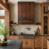 Hammered copper range hood in a bright Contemporary Craftsman kitchen with quarter-sawn oak, soapstone, and handmade tile