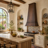 Mediterranean kitchen with tall tapered hand-hammered copper range hood, limewashed plaster, arches and natural oak