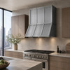 Natural zinc range hood in an urban contemporary kitchen with flat-panel cabinets and city views