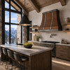 Alpine Contemporary Chalet kitchen with hammered copper range hood, timber beams and mountain view windows