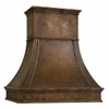 Side view of hammered copper bell range hood showing its deep apron, curved canopy profile and stepped crown