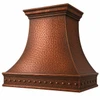 Angled hand-hammered bell copper range hood with riveted apron, antique finish and layered crown