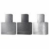 Three matching hand-hammered zinc range hoods in natural, darkened, and hand-polished finishes, shown side by side