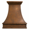 Front view of custom hammered copper range hood with sweeping bell shape, deep apron and architectural crown molding