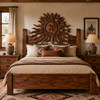 Mexican wooden headboard with hand carved sun and moon design in a ranch bedroom interior