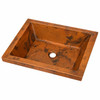Rectangular hammered copper bar sink in angled view with wide flat rim and textured artisan finish
