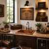 Rectangular hammered copper bar sink in a cigar lounge beverage area with rustic wood and leather seating