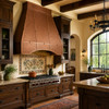 Riveted copper range hood in a Mission Revival kitchen with dark wood cabinets, plaster walls, and hand-painted tile