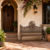 Horse medallion aluminum rustic garden bench with bronze finish beside a villa entry
