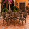Aluminum dining furniture sets with bronze finish and cactus design in a Mexican courtyard