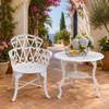 White heart scroll aluminum garden chair with romantic patio design on a Mediterranean patio