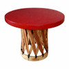 Round equipal table with a red terra cotta pigskin top