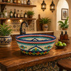 talavera cone shape round bath sink cobalt floral design on a kitchen bar with wood countertop and warm ambient light
