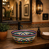 talavera cone shape round bath sink cobalt floral design in a restaurant restroom with rustic finishes and artisan decor