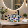 Mexican talavera floral cobalt bath bathroom sink installed in a modern bathroom with stone countertop