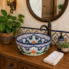 Mexican talavera floral cobalt bath bathroom sink in a bathroom vanity with natural light and wood accents