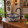 Talavera bath cone shape vessel sink with flowers installed in kitchen bar adding colorful focal point