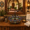 Talavera bath sink blue floral pattern design placed in a hacienda interior bathroom with bright window light