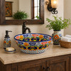 Floral talavera round bath cone shape vessel sink on bathroom vanity with natural light and warm wood accents