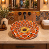 Talavera bathroom vessel sink orange lotus petal design in a restaurant restroom enhancing decorative ambiance with artisan detail