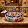 Mexican talavera donut vessel bathroom sink handcrafted design in restaurant restroom with vibrant decor and artisan tile details