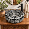 Round talavera vessel Mexican bathroom sink black white on Spanish vanity with warm rustic finishes