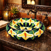 Talavera vessel bathroom sink calla lily floral design in restaurant bathroom with warm decor