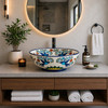 Talavera vessel sink round birds floral Mexican bathroom displayed in a modern bathroom with natural light and clean design